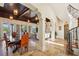Beautiful living room with tiled floors and elegant staircase at 801 Brightwaters Ne Blvd, St Petersburg, FL 33704