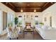Elegant living room with a fireplace, wood ceiling, and designer furniture at 801 Brightwaters Ne Blvd, St Petersburg, FL 33704