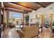 Bright and airy living room with brick ceiling, water view, and comfortable seating at 801 Brightwaters Ne Blvd, St Petersburg, FL 33704