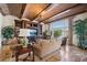 Comfortable living room with built-in entertainment center and expansive water views at 801 Brightwaters Ne Blvd, St Petersburg, FL 33704