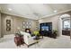 Cozy living room with a comfortable sofa, TV, and elegant decor provides a relaxing retreat at 801 Brightwaters Ne Blvd, St Petersburg, FL 33704
