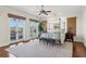 Spacious main bedroom with four-poster bed, hardwood floors, and balcony access at 801 Brightwaters Ne Blvd, St Petersburg, FL 33704