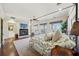 Bright main bedroom with fireplace, hardwood floors, and outdoor access at 801 Brightwaters Ne Blvd, St Petersburg, FL 33704