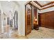 Classic office with wood accents, coffered ceiling, and adjacent to the main entrance at 801 Brightwaters Ne Blvd, St Petersburg, FL 33704