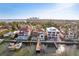 Luxury waterfront homes with private docks and boat slips along a canal, with the city skyline in the background at 801 Brightwaters Ne Blvd, St Petersburg, FL 33704