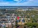 Aerial view of a beautiful home with a pool in a residential neighborhood with lake views at 9401 93Rd St, Seminole, FL 33777