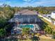 Aerial view of the private screened in pool and spa, with lush tropical landscaping at 9401 93Rd St, Seminole, FL 33777
