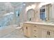 Bathroom featuring dual vessel sinks, granite countertops, and a tiled shower at 9401 93Rd St, Seminole, FL 33777
