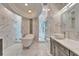 Bright, white bathroom features a clawfoot tub, dual shower and marble floors and walls at 9401 93Rd St, Seminole, FL 33777