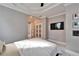 Bedroom with a bed, TV, and walk-in closets at 9401 93Rd St, Seminole, FL 33777