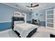 Inviting bedroom featuring modern decor, a sleek workspace, and unique glass doors, ideal for comfort at 9401 93Rd St, Seminole, FL 33777