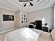 Bedroom features modern furnishings, a TV, and a sleek workspace for functionality at 9401 93Rd St, Seminole, FL 33777