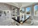 Spacious dining room with a modern table, stylish chairs, and access to the grand foyer at 9401 93Rd St, Seminole, FL 33777