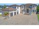 Attractive home featuring a three-car garage, tile roof, decorative windows, and spacious paved driveway at 9401 93Rd St, Seminole, FL 33777