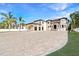 Spacious home boasting an expansive driveway, three-car garage, and meticulously maintained landscaping at 9401 93Rd St, Seminole, FL 33777