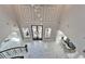 Grand foyer featuring high ceilings, elegant chandeliers, intricate marble floors, and a statement front door at 9401 93Rd St, Seminole, FL 33777