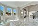 Bright foyer with ample natural light, stylish seating and eye-catching decor at 9401 93Rd St, Seminole, FL 33777