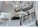 Expansive foyer featuring a winding staircase, soaring ceilings, and marble floors at 9401 93Rd St, Seminole, FL 33777