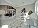 Stately foyer featuring a wrought iron staircase, chandelier and stylish decor at 9401 93Rd St, Seminole, FL 33777