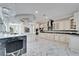 Gourmet kitchen with stainless steel appliances, custom cabinets, and a large center island at 9401 93Rd St, Seminole, FL 33777