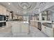 Large, open gourmet kitchen with island, stainless steel appliances, and marble floors at 9401 93Rd St, Seminole, FL 33777