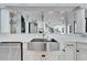 Gourmet kitchen featuring a stainless steel farm sink with a view of the staircase and living areas at 9401 93Rd St, Seminole, FL 33777