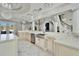 Gourmet kitchen with marble countertops, island sink, custom cabinets, and chandeliers at 9401 93Rd St, Seminole, FL 33777