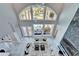 Elevated view of a living room featuring high ceilings, a fireplace, and access to the outdoor area at 9401 93Rd St, Seminole, FL 33777