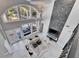 Aerial view of a living room featuring high ceilings, a fireplace, and access to the outdoor pool area at 9401 93Rd St, Seminole, FL 33777