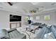 Spacious living room with decorative ceilings, ceiling fans, and comfortable sofas at 9401 93Rd St, Seminole, FL 33777