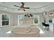 Sun-drenched bedroom offers a round bed, modern ceiling fan, and a dedicated vanity at 9401 93Rd St, Seminole, FL 33777