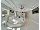 Spacious primary bedroom with round bed, television, modern lighting, and doorway view at 9401 93Rd St, Seminole, FL 33777