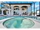 Inviting pool and spa with beautiful tile work, perfect for outdoor relaxation and entertaining guests at 9401 93Rd St, Seminole, FL 33777