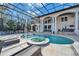 A large screened pool and spa provide a wonderful backyard oasis for relaxation and entertainment at 9401 93Rd St, Seminole, FL 33777