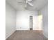 Bedroom showcasing carpet flooring, a ceiling fan, and a closet, perfect for relaxation at 10232 Grant Creek Dr, Tampa, FL 33647
