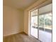 Bright bedroom featuring sliding glass door, plush carpet flooring, and neutral walls at 10232 Grant Creek Dr, Tampa, FL 33647