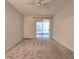 Spacious bedroom with sliding glass door to outside featuring neutral paint and carpet at 10232 Grant Creek Dr, Tampa, FL 33647