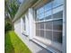 Exterior shot featuring hurricane shutters and a view of the surrounding landscape at 10232 Grant Creek Dr, Tampa, FL 33647