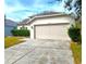 Charming single-story home with a well-manicured lawn and two car garage at 10232 Grant Creek Dr, Tampa, FL 33647