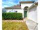 Inviting front entrance with a green door and manicured landscaping at 10232 Grant Creek Dr, Tampa, FL 33647