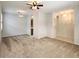 Spacious living room featuring carpet flooring, neutral walls, and open layout at 10232 Grant Creek Dr, Tampa, FL 33647
