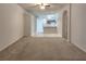 Open floor plan featuring a carpeted living room that flows into the kitchen at 10232 Grant Creek Dr, Tampa, FL 33647