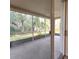 Relaxing screened-in patio overlooking a private yard with lush greenery at 10232 Grant Creek Dr, Tampa, FL 33647