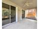 Spacious screened-in lanai has sliding door access and ceiling fan for outdoor living and enjoyment at 10232 Grant Creek Dr, Tampa, FL 33647