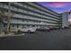 Exterior view of the building featuring balconies and convenient parking at 1868 Shore S Dr # 209, South Pasadena, FL 33707
