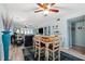 Open-concept living room seamlessly integrates with a dining area, offering ample natural light and stylish decor at 1868 Shore S Dr # 209, South Pasadena, FL 33707