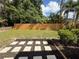 Well-maintained backyard with a new wooden fence and lush green grass at 20 Cypress Dr, Palm Harbor, FL 34684