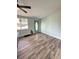 Inviting living room features a lovely door with stained glass and light-colored walls over a wood floor at 20 Cypress Dr, Palm Harbor, FL 34684