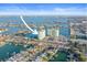 Aerial view of a waterfront condo community with boat docks and a swimming pool at 420 64Th Ave # 1005, St Pete Beach, FL 33706