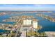 Aerial view of a waterfront condo complex near a neighborhood with canals and boat docks at 420 64Th Ave # 1005, St Pete Beach, FL 33706